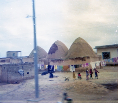 Beehive houses near Bab-El-Hawa, with children who came begging for cigarettes